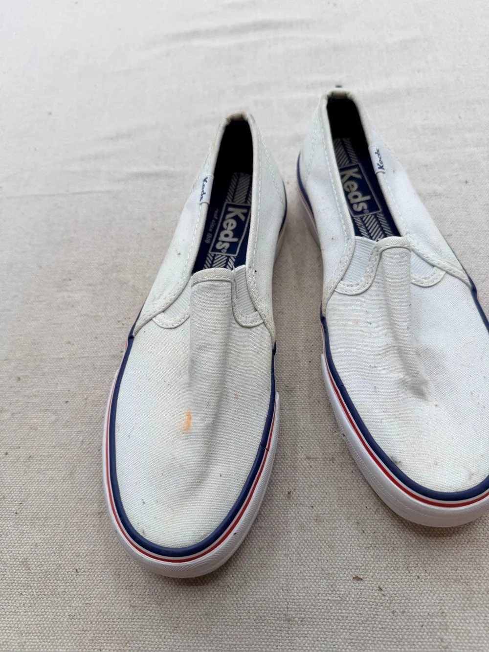 Keds White Canvas Slip-On Loafers with Red & Blue Trim